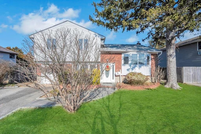 view of front of home with a front lawn