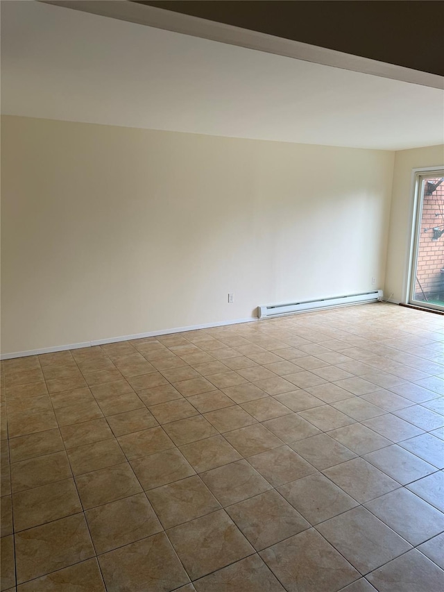 tiled empty room featuring baseboard heating