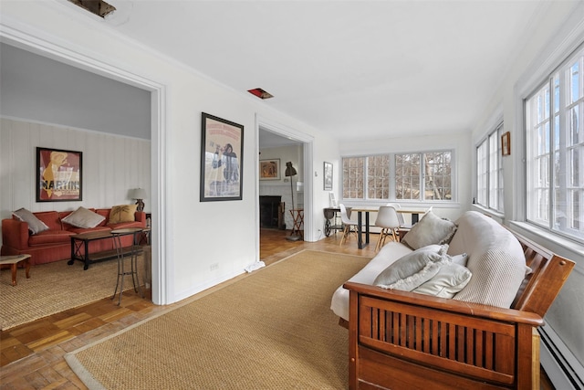 sunroom / solarium with a baseboard heating unit