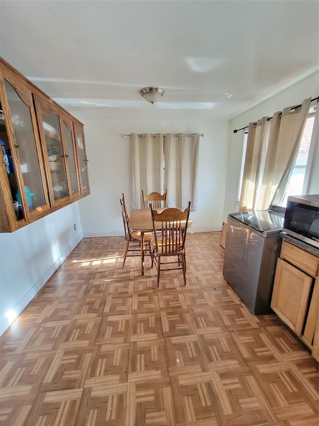 dining space featuring baseboards