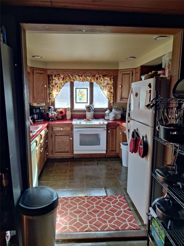 kitchen with sink and white appliances