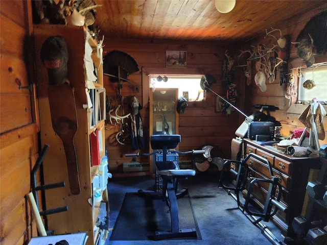 workout room featuring carpet floors and wooden ceiling