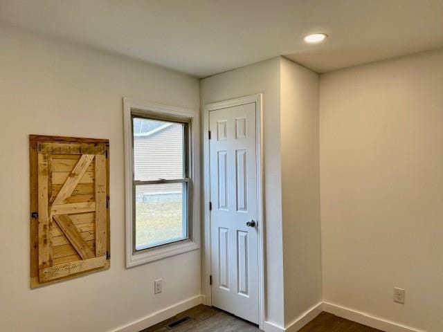 spare room featuring dark hardwood / wood-style floors