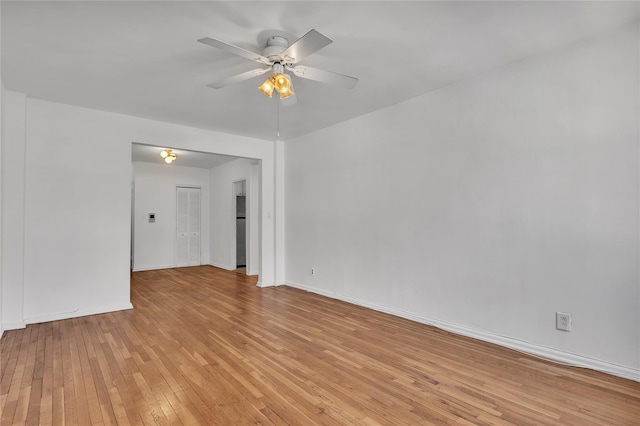 empty room featuring light hardwood / wood-style floors and ceiling fan