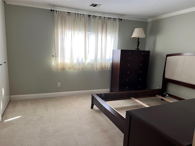 bedroom with carpet flooring and ornamental molding