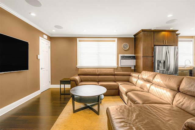 living room with ornamental molding, sink, dark hardwood / wood-style floors, and heating unit