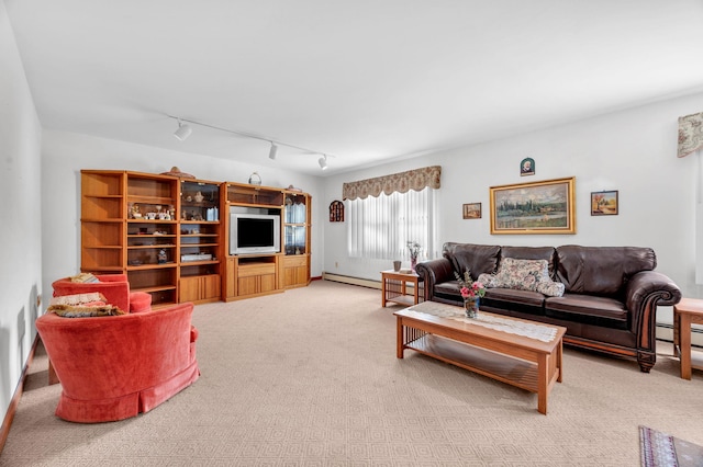 living area with rail lighting, a baseboard radiator, and carpet flooring