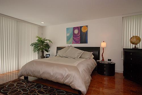 bedroom featuring dark wood-type flooring