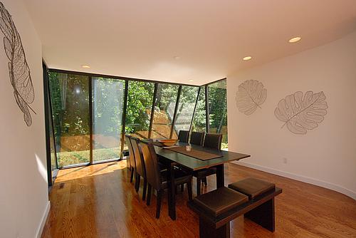 dining space featuring plenty of natural light and wood-type flooring