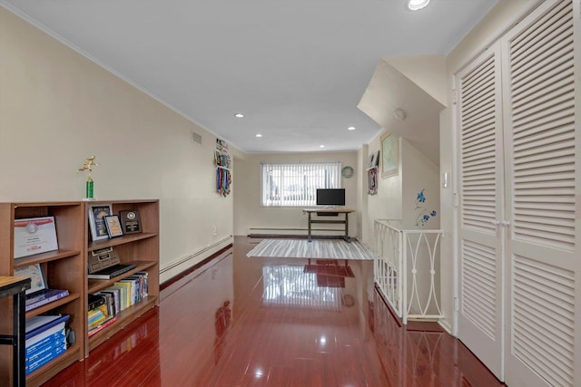 hall with dark wood-style flooring, recessed lighting, visible vents, baseboard heating, and a baseboard heating unit