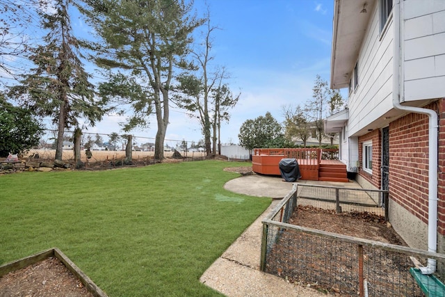 view of yard featuring a fenced backyard, a patio, and a wooden deck