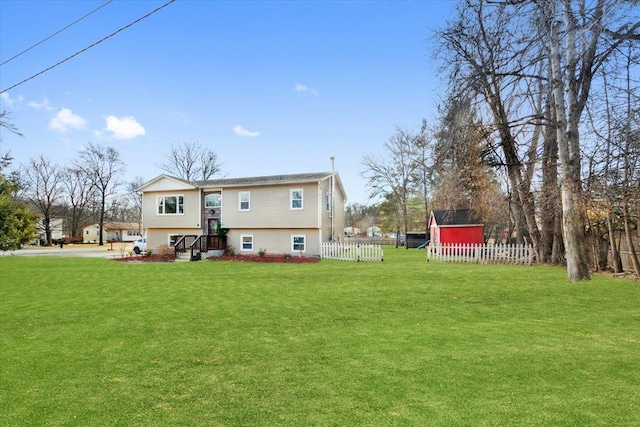 rear view of property with a lawn