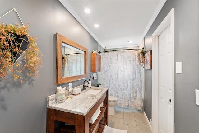 bathroom with toilet, vanity, and crown molding