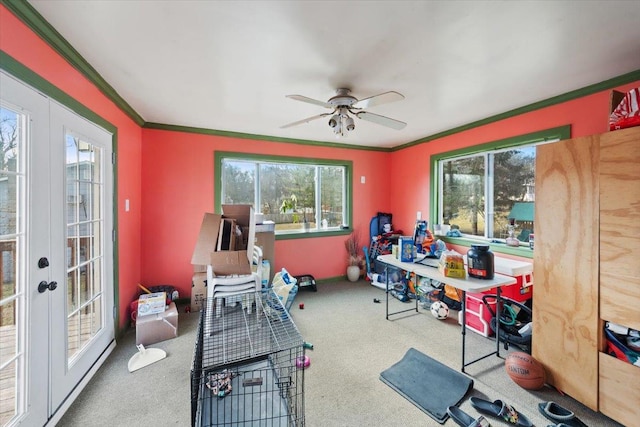 interior space with carpet flooring, a healthy amount of sunlight, and french doors