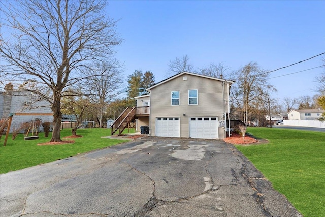 view of property exterior with a garage and a yard