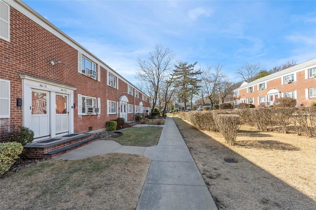 view of home's community featuring a yard