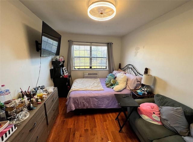 bedroom featuring dark hardwood / wood-style floors