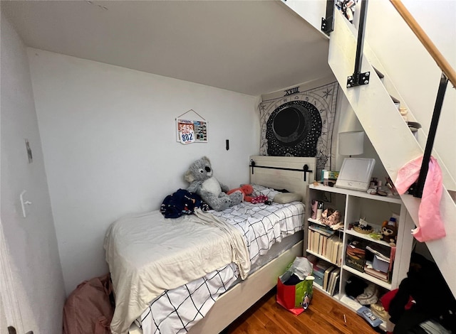 bedroom with wood-type flooring