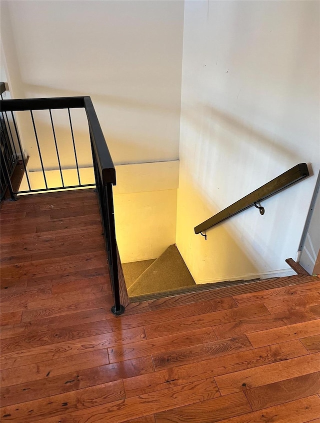 stairway featuring hardwood / wood-style floors