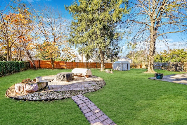 view of yard with a shed and a patio