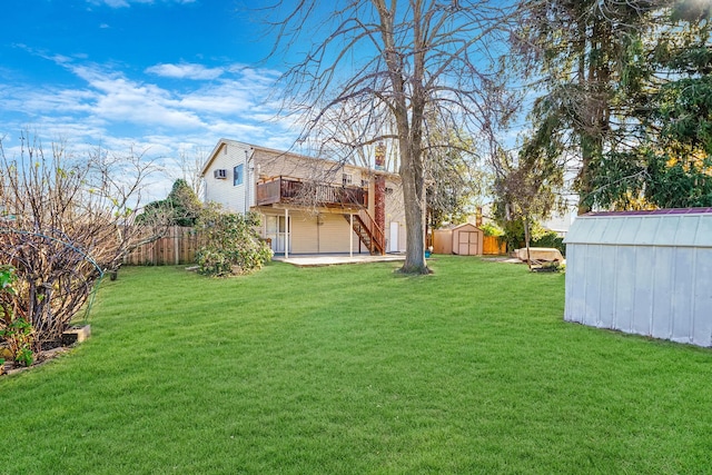 view of yard with a deck and a storage shed