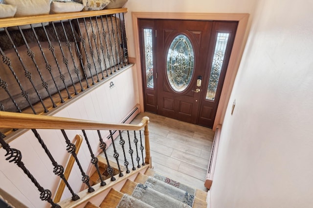 entrance foyer with wood-type flooring and a baseboard radiator