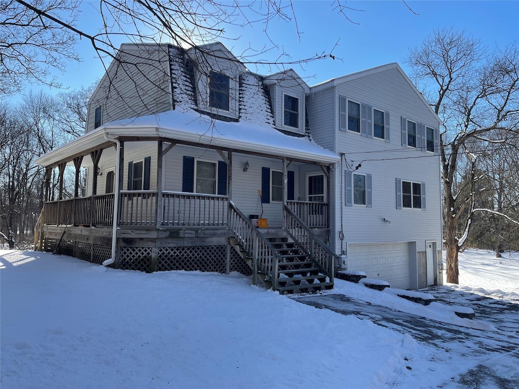 view of front of property with a garage and covered porch