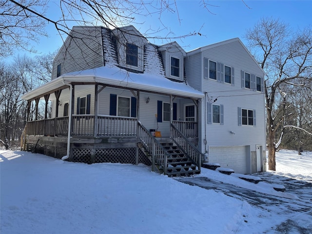 view of front of property with a garage and covered porch