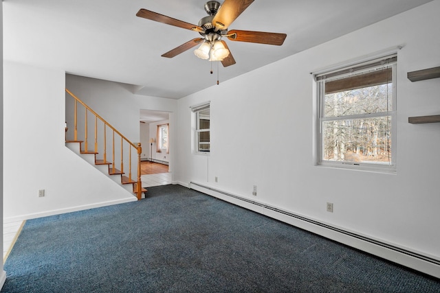 unfurnished living room with ceiling fan, a baseboard radiator, and light colored carpet