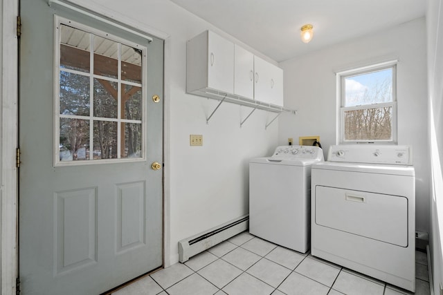 laundry area featuring cabinets, a baseboard radiator, separate washer and dryer, and light tile patterned floors