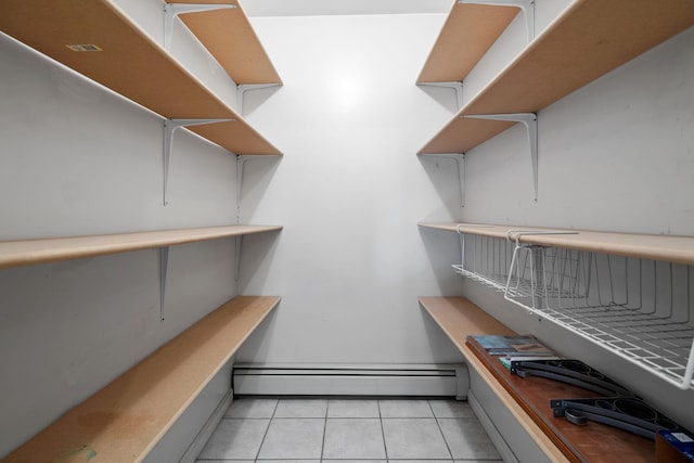 pantry featuring a baseboard heating unit