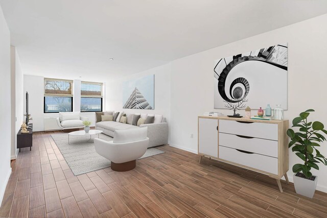 living area with wood finish floors and baseboards