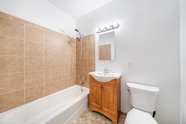 bathroom featuring tile patterned floors, vanity, toilet, and shower / bathtub combination