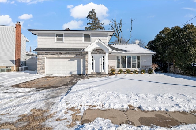 front facade with a garage