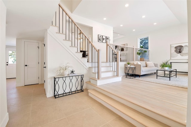 stairway with tile patterned floors