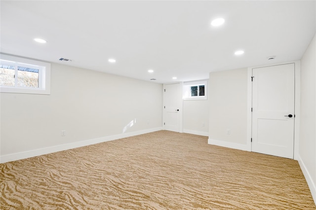 empty room featuring light carpet