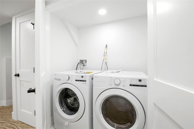 laundry area with washing machine and clothes dryer