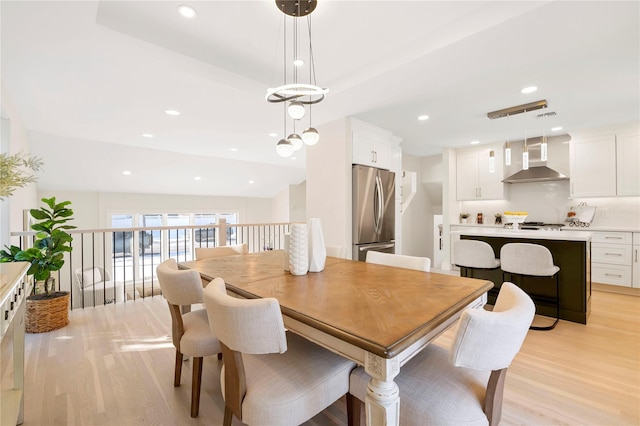 dining room with light hardwood / wood-style flooring