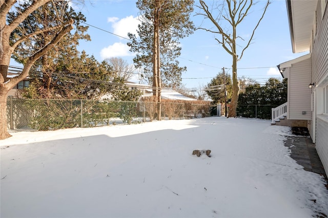 view of yard layered in snow