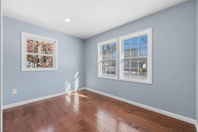 empty room featuring hardwood / wood-style flooring