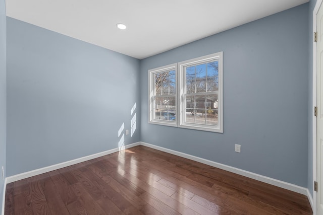 spare room featuring dark hardwood / wood-style floors