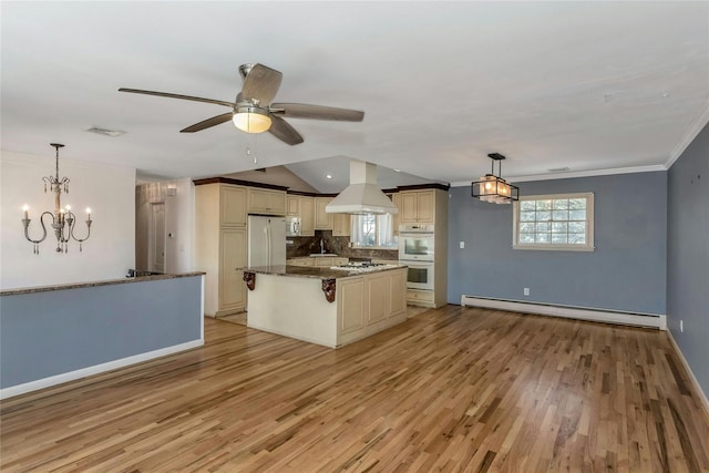 kitchen with white appliances, island range hood, decorative backsplash, a baseboard radiator, and cream cabinetry