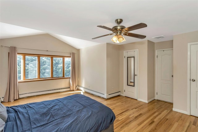 bedroom featuring light hardwood / wood-style flooring, a baseboard radiator, lofted ceiling, and ceiling fan