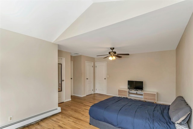 bedroom featuring vaulted ceiling, ceiling fan, light wood-type flooring, and a baseboard heating unit