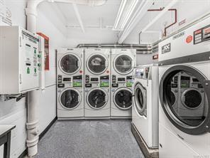 laundry area with washer and dryer and stacked washer / dryer