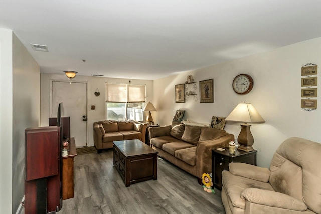 living room featuring dark wood-type flooring