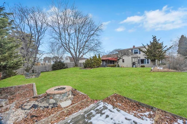 view of yard with a fire pit