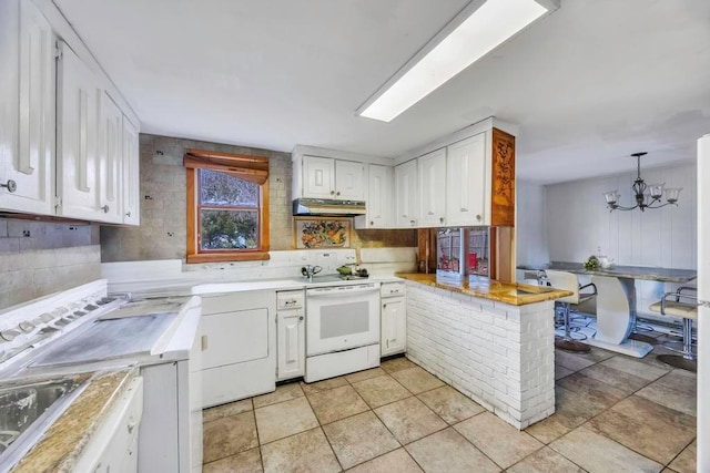 kitchen featuring white electric range, white cabinetry, hanging light fixtures, range hood, and kitchen peninsula