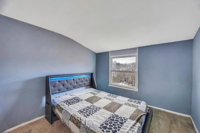 carpeted bedroom featuring vaulted ceiling