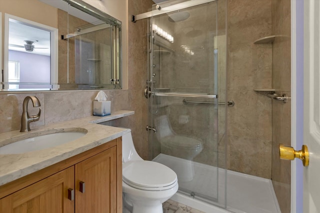 bathroom featuring vanity, backsplash, toilet, and walk in shower